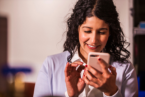 Woman accessing COVID-19 data dashboard on phone